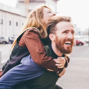 young-couple-hugging-outdoor-smiling-2022-01-19-00-57-02-utc-scaled